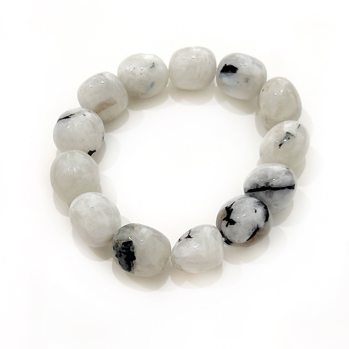 A Moonstone Tumble Bracelet, featuring beads of soft luminous hues with an ethereal glow, each around 12-15mm, embodying the mystical energy of the moon and symbolizing new beginnings and intuition. | Simply Esoteric
