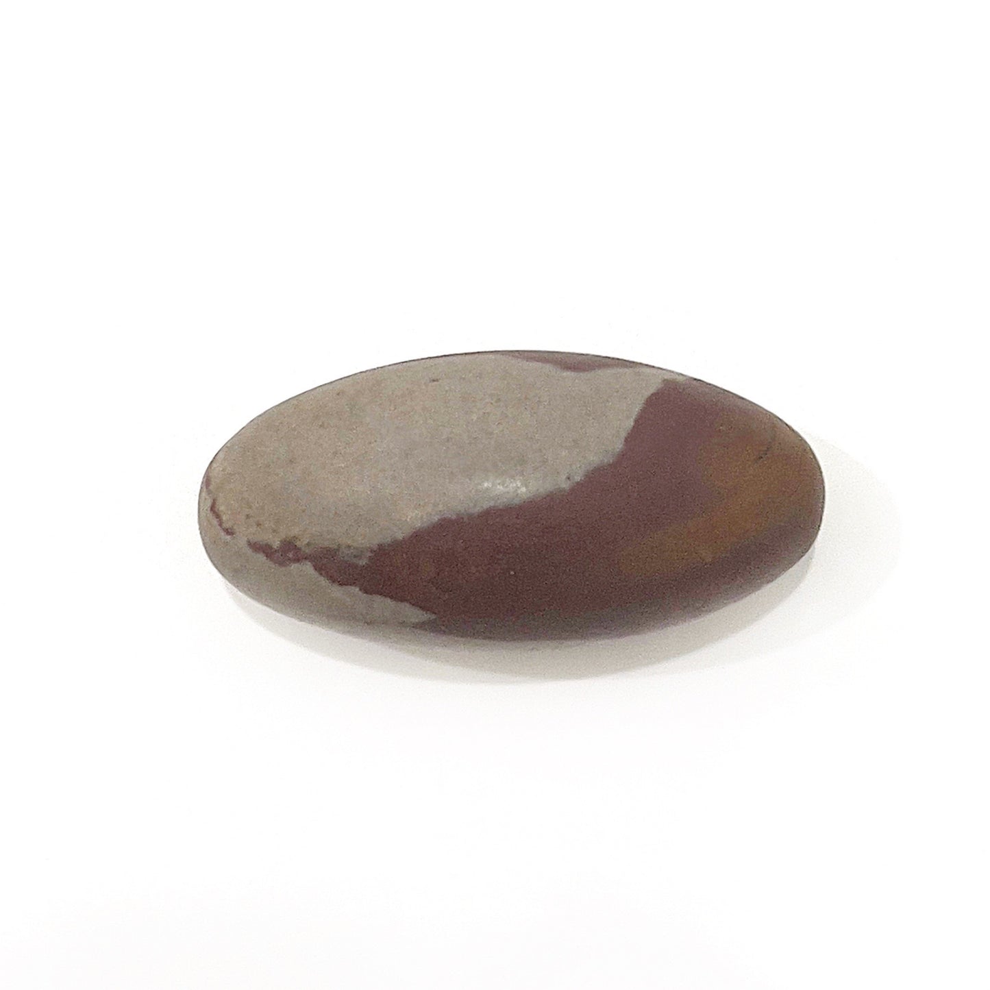A Shiva Lingam stone, smooth and elongated, with a distinctive pattern of deep brown and tan hues that symmetricaly adorn its length. The stone's polished surface and oval shape provide a tactile experience, showcased on a plain white background that highlights its natural and sacred form. | Simply Esoteric