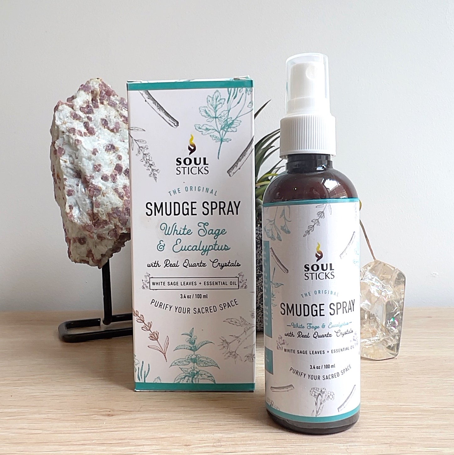 Soul Sticks White Sage & Eucalyptus Smudge Spray 100ml with real quartz crystals, packaged in a labelled spray bottle and box, displayed on a wooden surface. | Simply Esoteric