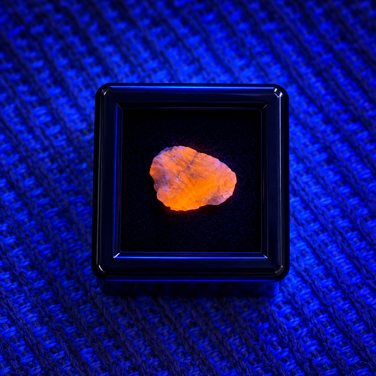 Hauyne micro mineral specimen showing bright orange fluorescence under UV light Australia