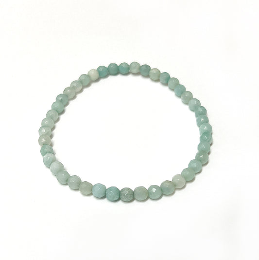 A serene Amazonite bead bracelet featuring 4mm faceted beads in calming blue-green shades, strung on an 18cm stretchy cord for a comfortable and flexible fit.