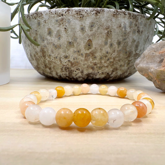 Handmade Yellow Aventurine crystal bead bracelet with 6mm round beads on stretchy cord, glowing with golden tones, symbolising confidence, joy, and empowerment. | Simply Esoteric