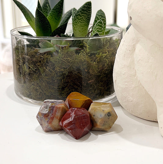 Ocean Jasper Dodecahedrons approximately 2-2.5cm in size, showcasing intricate patterns and vibrant colors ranging from greens and blues to yellows and pinks, displayed on a light background. | Simply Esoteric