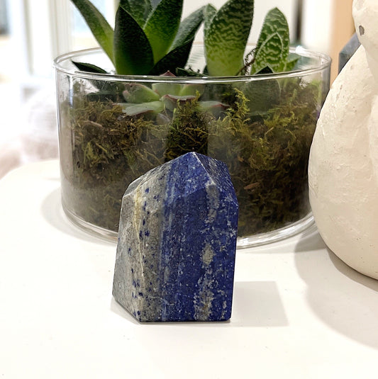 Lapis Lazuli Geolith approximately 5-6cm in height, featuring deep blue hues with shimmering pyrite and white calcite veins, displayed on a light background. | Simply Esoteric