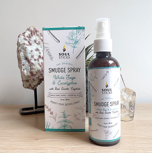 Soul Sticks White Sage & Eucalyptus Smudge Spray 100ml with real quartz crystals, packaged in a labelled spray bottle and box, displayed on a wooden surface. | Simply Esoteric